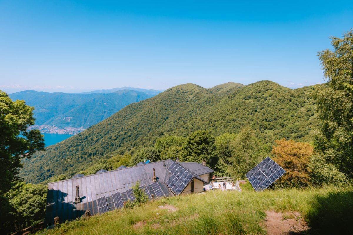 Residents installing off-grid solar panels in remote community.