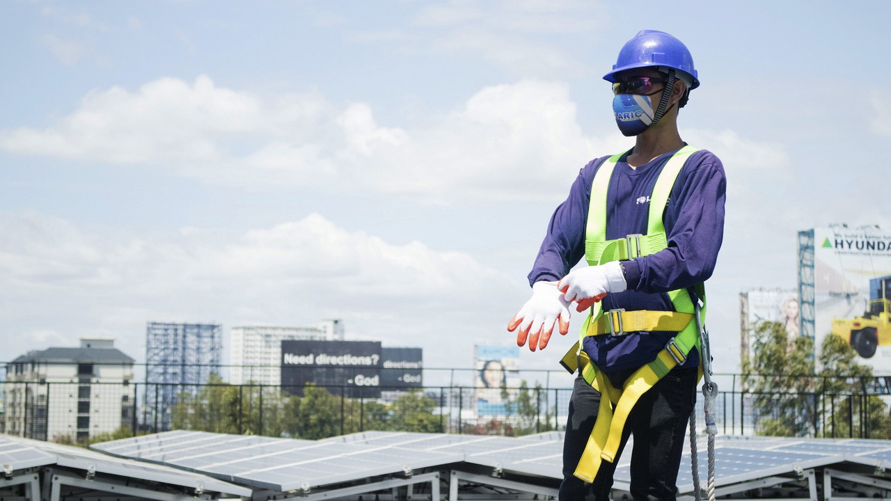 A Solaric worker in a new PPE