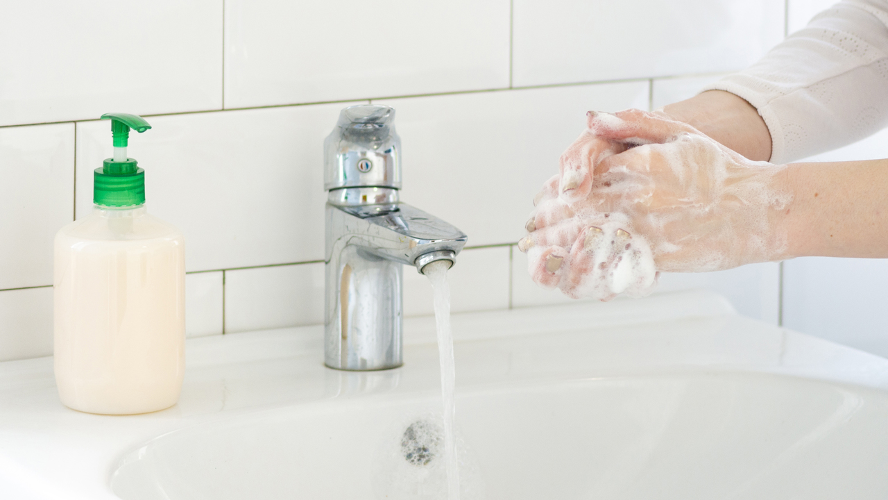 A person washing their hands