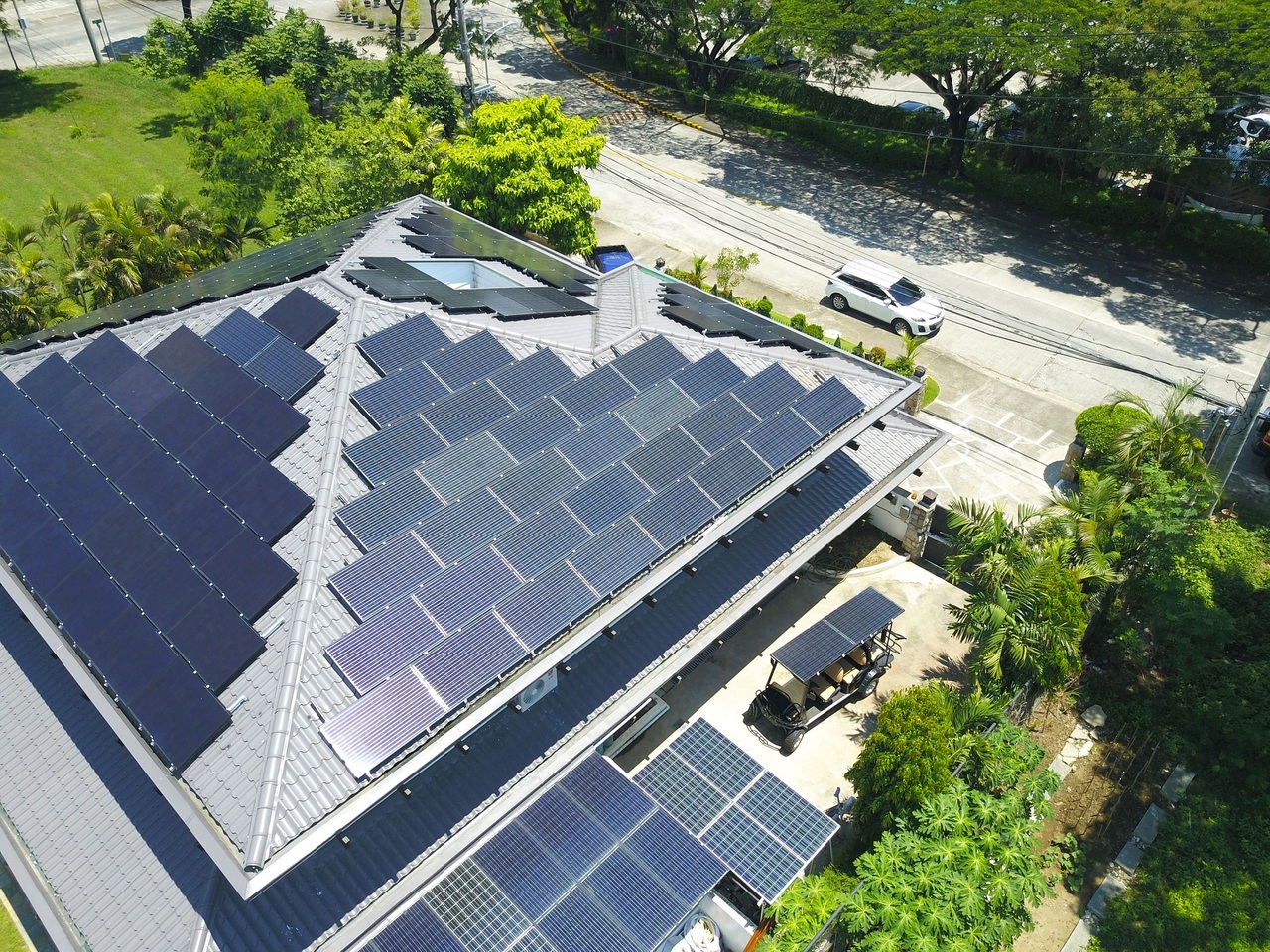Top shot of a home with solar panels on its rooftop