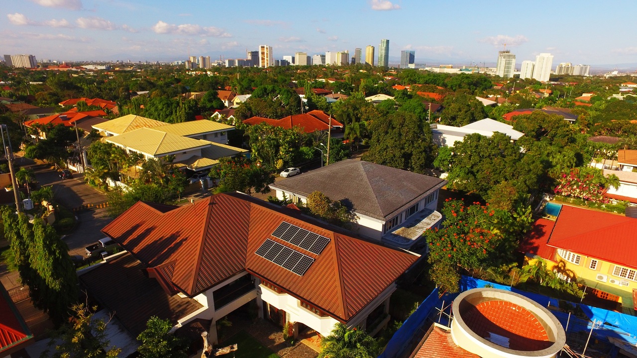 Overview of a village with rooftop solar panels