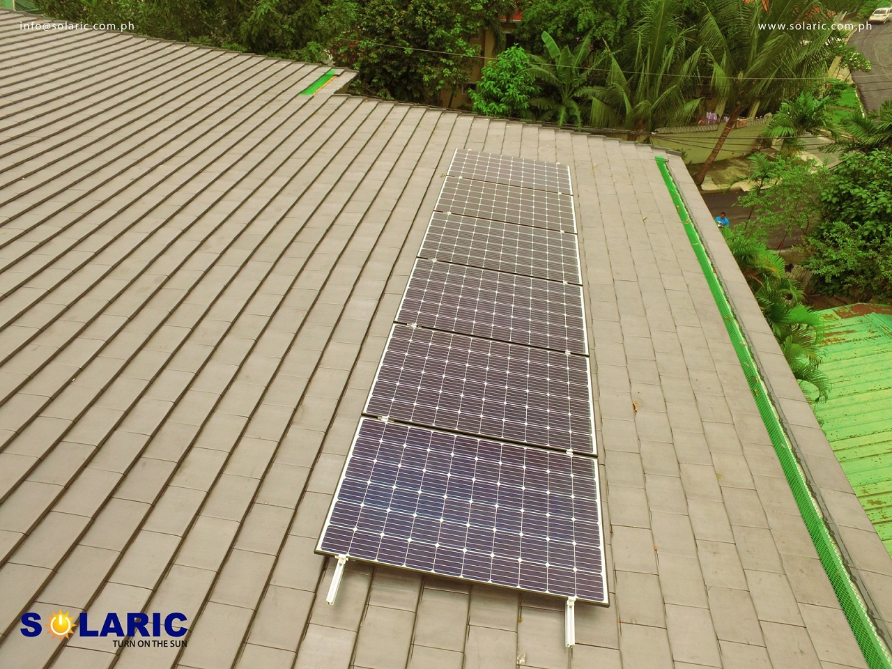 A line of solar panels on a roof