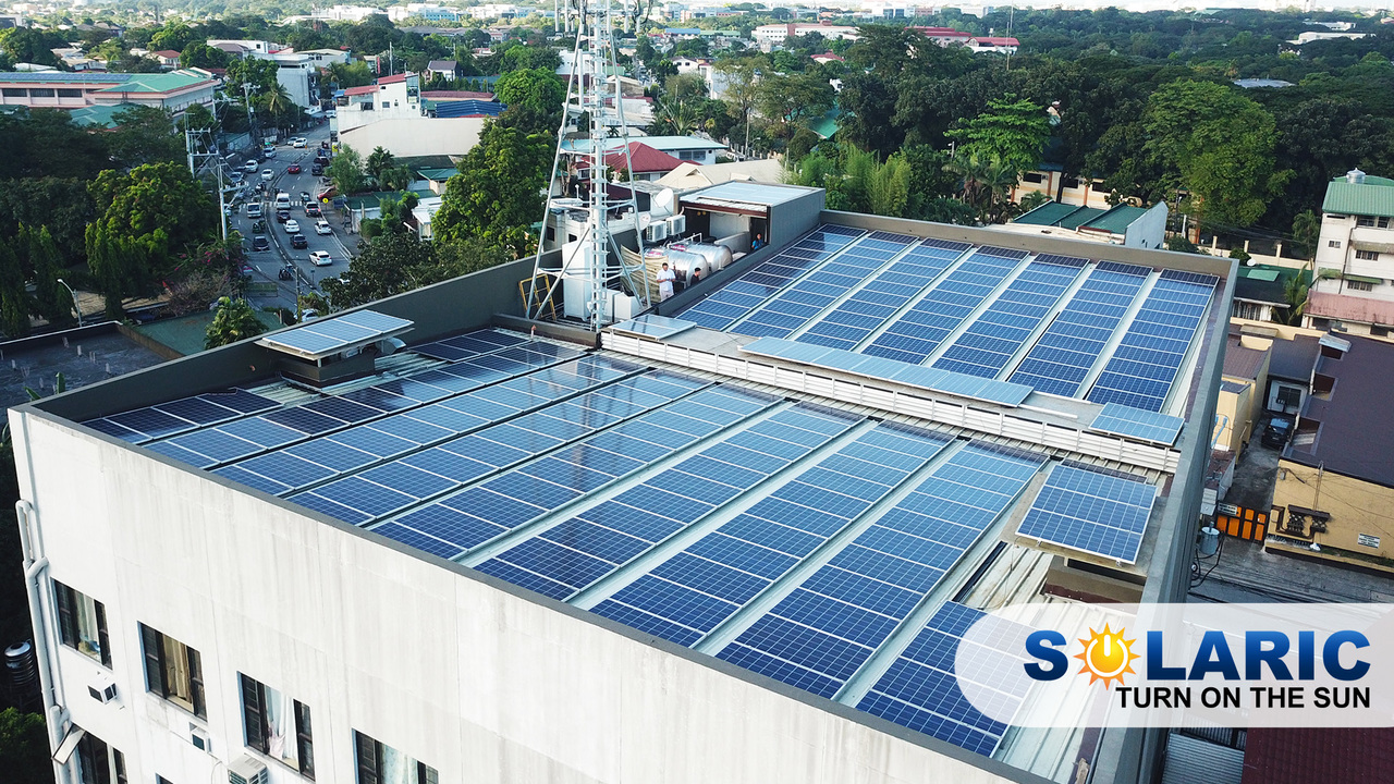 A rooftop completely covered by solar panels