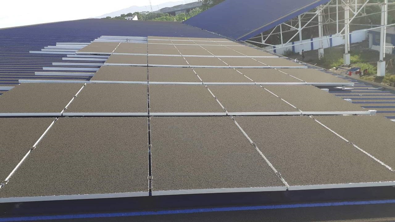 Solar panels completely covered in volcanic ash