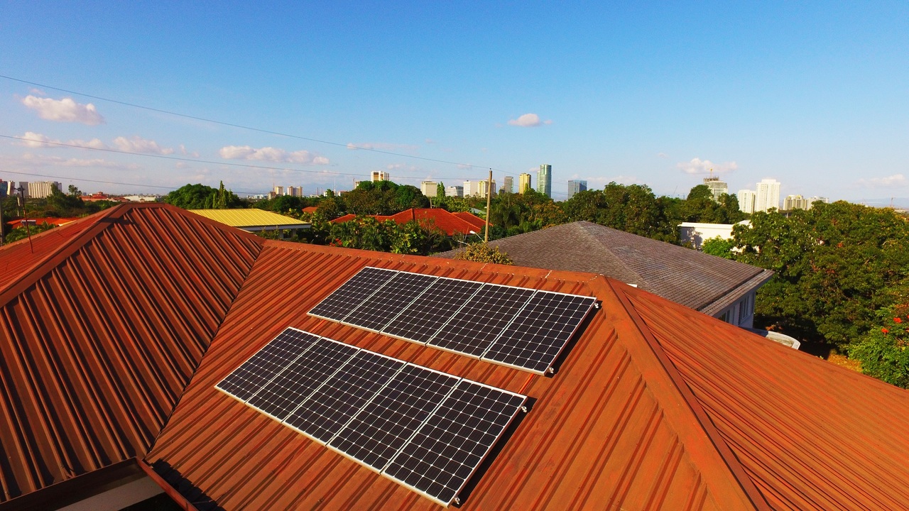 A solar panel installed to face the sun on a roof