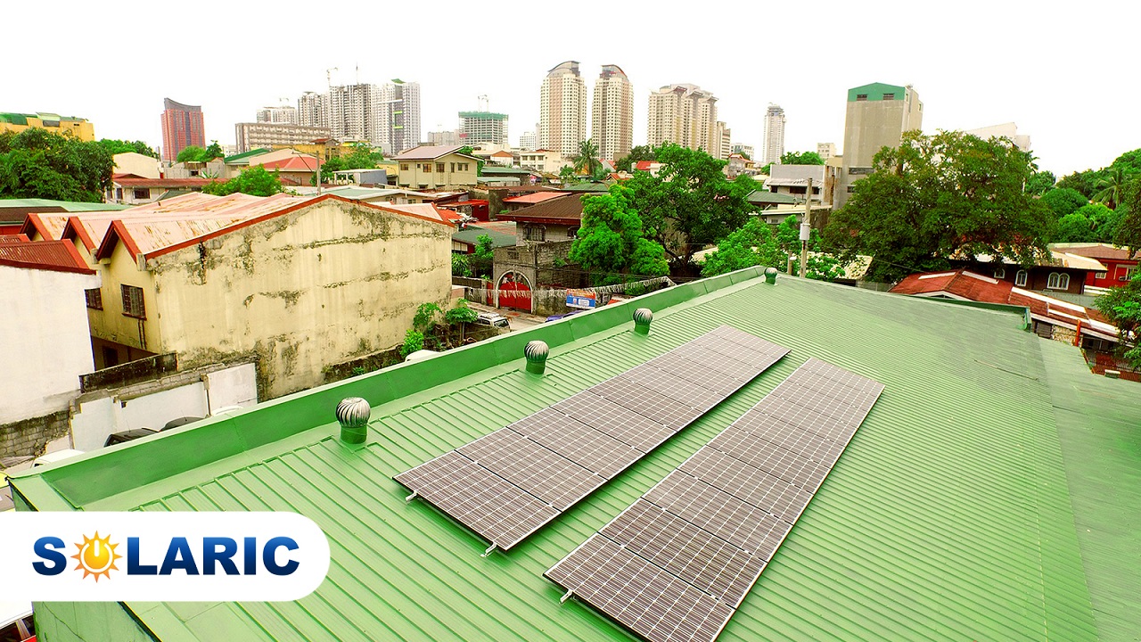 Solaric solar panels on a green rooftop