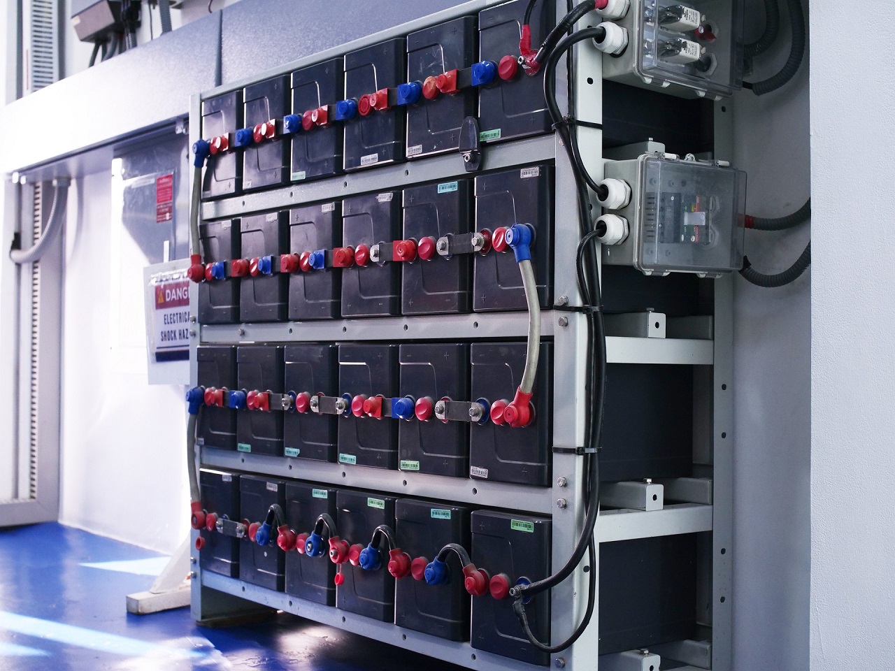 close-up of solar batteries stacked against a wall