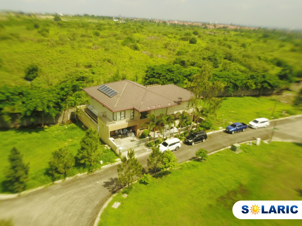 A house in a forest in the Philippines with solar roofing